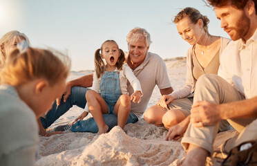 Family, children and generations at beach for sand castle with bonding, excited and wow on vacation. Parents, grandfather and kids on ground with surprise, helping hand and happy for game in Spain