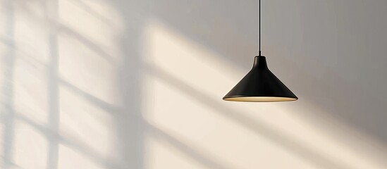 Minimalist Black Pendant Light Against a White Wall