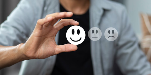 Customer showing rating feedback review with happy smile icon, customer satisfaction survey 	