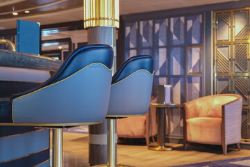Luxurious observation or panorama lounge with floor to ceiling windows onboard cruiseship or cruise...