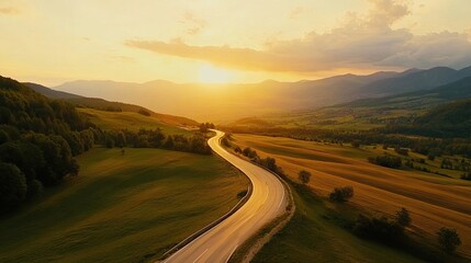 A winding road snakes through lush green valleys, bathed in the golden glow of a sunset. The road leads towards a distant town nestled amidst rolling hills.