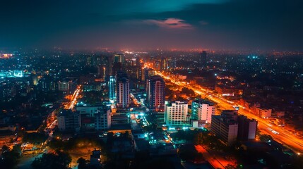 An aerial view of Gurugram downtown at night, highlighting the illuminated buildings and vibrant cityscape in the Haryana district of India.
