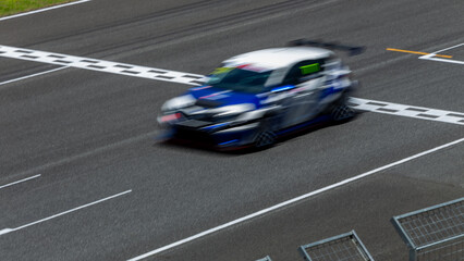 Motion blur race car racing on speed track, Car race on the international circuit race track...