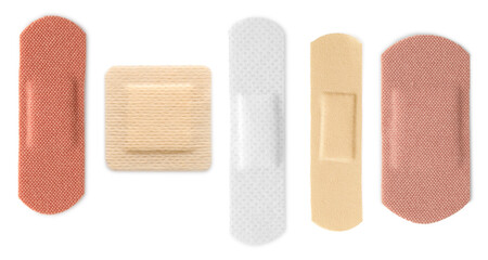 Many different medical plasters isolated on white, set
