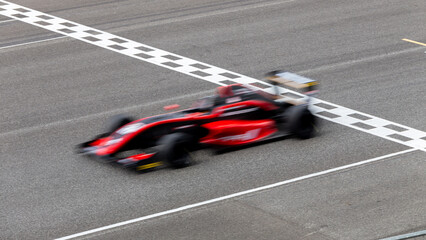 Motion blur race car racing on speed track, Car race on the international circuit race track...