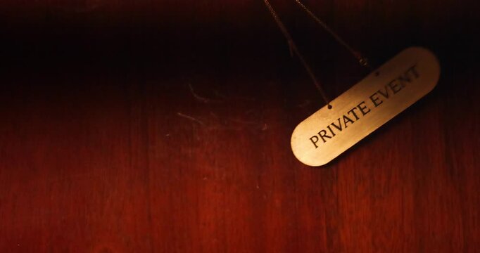 sign PRIVATE EVENT is swaying in the frame. slow motion. vip. members only 