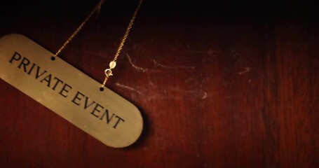 sign PRIVATE EVENT is swaying in the frame. slow motion. vip. members only 