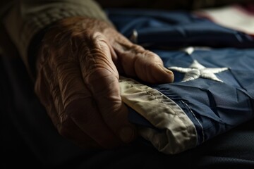 Veteran holding a folded American flag.