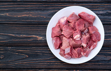 Beef cubes . Photography of raw cutting meat