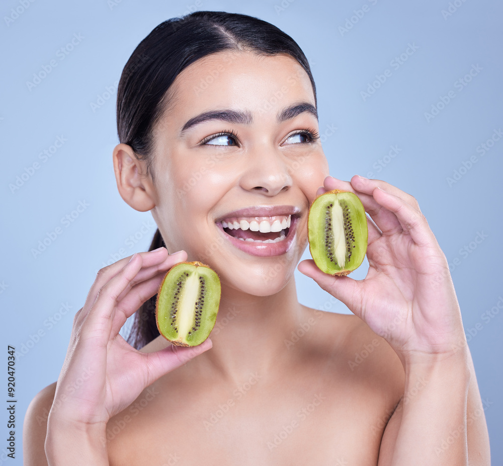 Sticker Studio, thinking and woman with kiwi for skincare, vitamin c and minerals for nutrient for healthy living. Female person, face and fruit by blue background for wellness, organic and beauty treatment