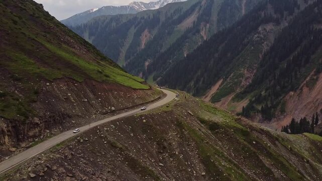 Aerial View of drone moving forward over a high mountain pass (Mughal Road) Near Peer Ki Gali in Kashmir
