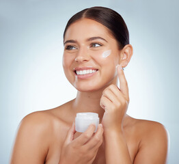 Woman, happy and cream jar for skincare in studio on grey background with routine, ingredients and satisfied for results. Body natural and Smile in confidence with facial treatment and skin lotion