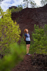 Fototapeta premium Woman in an extinct volcano caldera, hiking