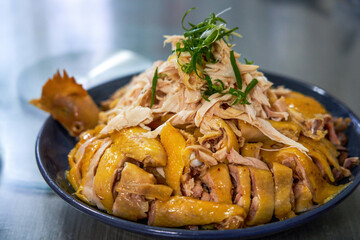 A plate of fresh and delicious white-cut chicken, hand-shredded chicken