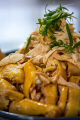 A plate of fresh and delicious white-cut chicken, hand-shredded chicken
