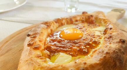 Pastry with cheese filling and egg.  Georgian cuisine.  Nutrition concept.