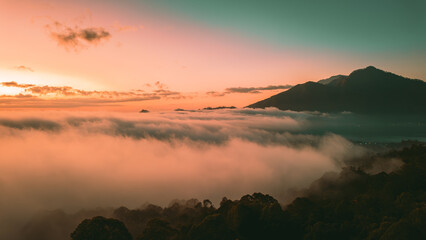 Fototapeta premium Spectacular Sunrise Over Mount Batur Volcano, Bali, Indonesia. Summer time. Drone 4k footage.