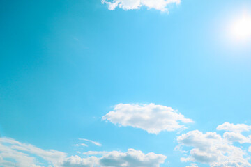 Sunny day. Blue sky with white clouds and sun. Sunburst With Lens Flare. Heavens with bright weather, summer season outdoor
