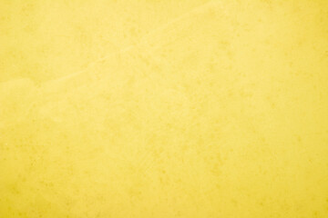 Yellow concrete stone texture for background in summer wallpaper. Cement and sand wall of tone vintage minimal. Concrete abstract wall of light yellow color, cement texture white blank for home decor.
