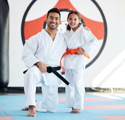 Child, teacher or portrait in karate dojo for training, fighting exercise or martial arts education. Learning, practice or proud judo master with girl kid in studio for taekwondo lesson or workout © Fanti/peopleimages.com