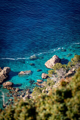 Banyalbufar in Mallorca - rocky cliffs on a summer day with blue water