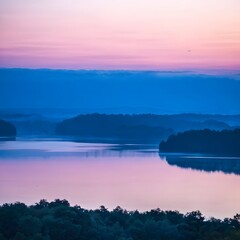 Fototapeta premium Reflections of trees on a still lake at dawn