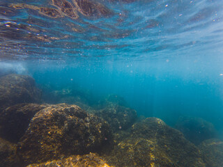 Underwater action camera photo. Mediterranean Sea off the coast of Nice in southern France, seabed and rocks.