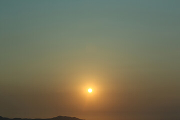 Sea with twilight sky when the sunset and the mountain.