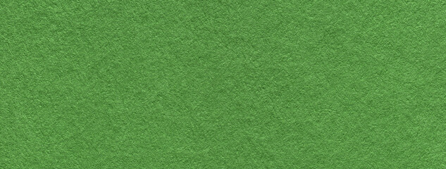 Texture of craft green paper background colors, macro. Structure of vintage kraft cardboard.