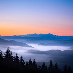 Sunrise over a misty mountain range with soft colors