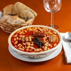 Typical asturian fabada dish served in a restaurant. Spanish cuisine.