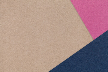 Texture of craft brown color paper background with purple and navy blue border. Vintage abstract beige cardboard.