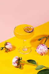 Cocktail spritz with passion fruit on blue background
