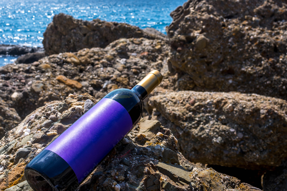 Sticker Bottle of wine by the sea