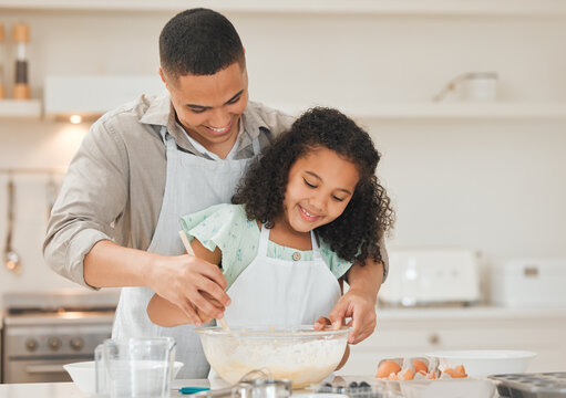 Learning, child and father with baking in kitchen for helping, support and teaching cake recipe in home. Happy family, man and girl kid with ingredients preparation for cooking education and bonding