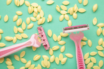 Wax granules for depilation with a razor on mint background