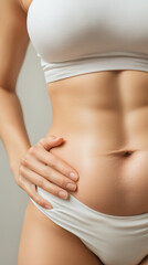 unrecognizable young woman with her hands on her belly