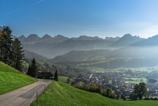 Village in Toggenburg with the Churfirsten mountains in background, Neu St. Johann, Canton of St. Gallen, Switzerland