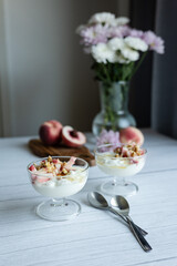 Greek yoghurt with peach and honey. Hight key. Place for text