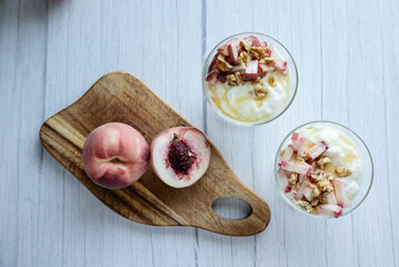 Greek yoghurt with peach and honey. Hight key. Place for text