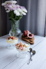 Greek yoghurt with peach and honey. Hight key. Place for text