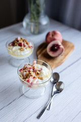 Greek yoghurt with peach and honey. Hight key. Place for text