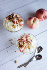 Greek yoghurt with peach and honey. Hight key. Place for text