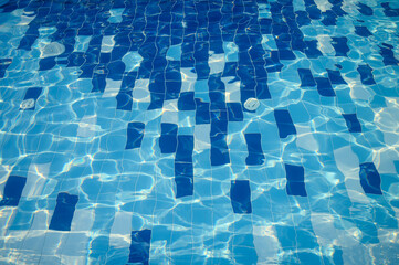 Swimming Pool Surface With Light Reflection and Water Ripple Patterns