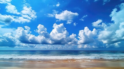 Abstract cloud formations in a blue sky over a tropical beach. Summer getaway perfection.