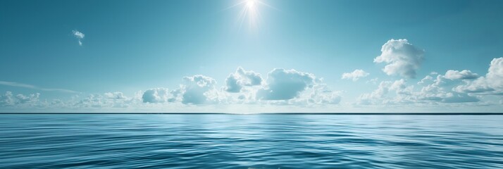 A calm ocean scene with bright sunlight gleaming off the water surface and scattered, fluffy clouds floating across a clear blue sky.