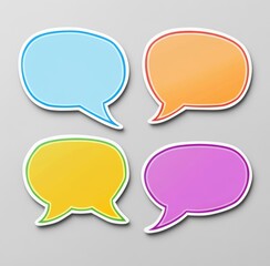Fototapeta premium Four colorful speech bubbles on a gray background for creative design and communication concepts