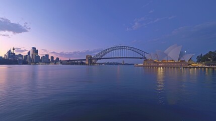 Obraz premium Panoramic view of Sydney Harbour with iconic landmarks - Opera House and Harbour Bridge. Calm waters, twilight hues, boats add to its beauty and cultural significance.