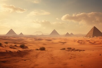 Desert landscape with the pyramids on the horizon.