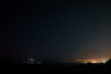 Lightning thunderstorm flash over the night sky. Concept on tropic weather, cataclysms, hurricane,...